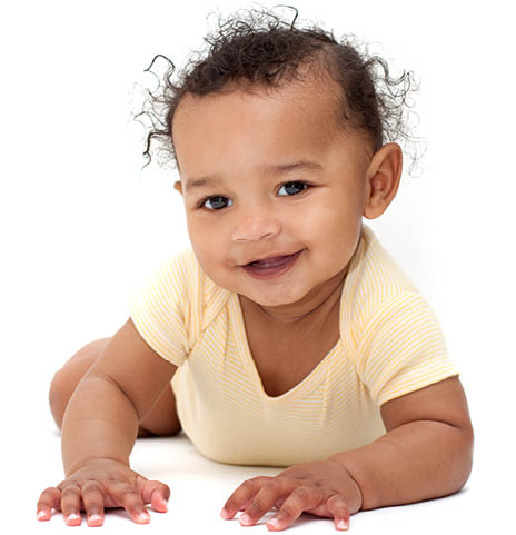  Sweet baby in yellow lying on tummy and smiling  Mixed race, african american  