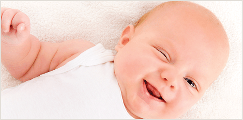 Hilarious winking baby boy of 2 m o 